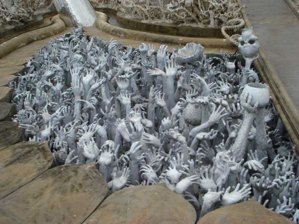 Temple art hands reaching up